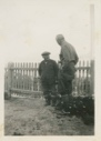 Image of Dr. Paul Hettasch talking with Eskimo [Inuk] man